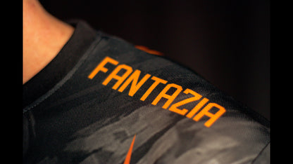 Fantazia wordmark printed on the left sleeve of the kitsune flame jersey